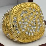 ICED OUT BASKETBALL CHAMPION RING --- GOLD BODY, STONES ON BALL (Item #59-56)