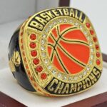 VARSITY BASKETBALL CHAMPION RING --- GOLD BODY, ORANGE STONE (Item #52-128)